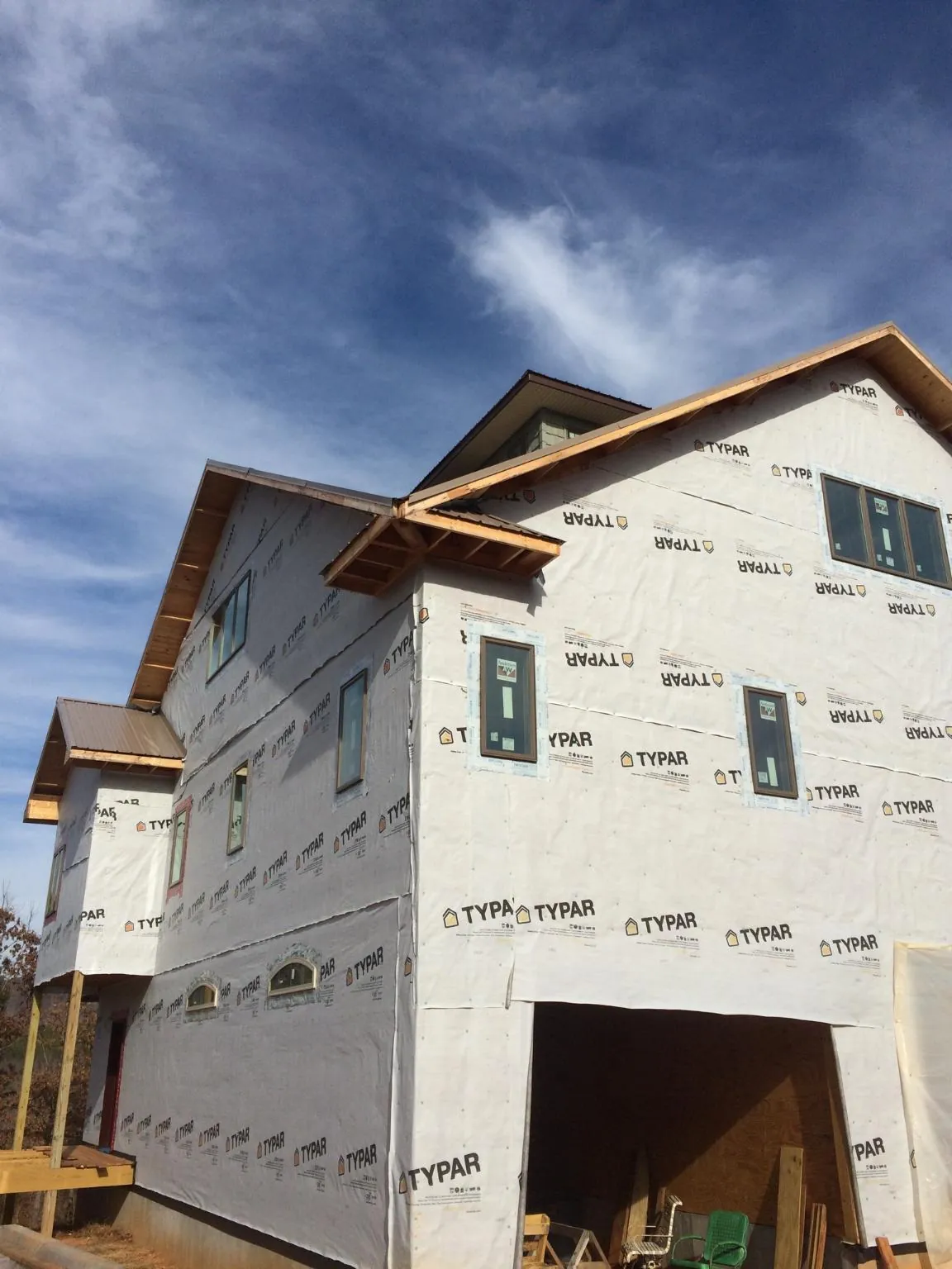 Stick built house wrapped in Typar with new roof framing and dormers in Solon